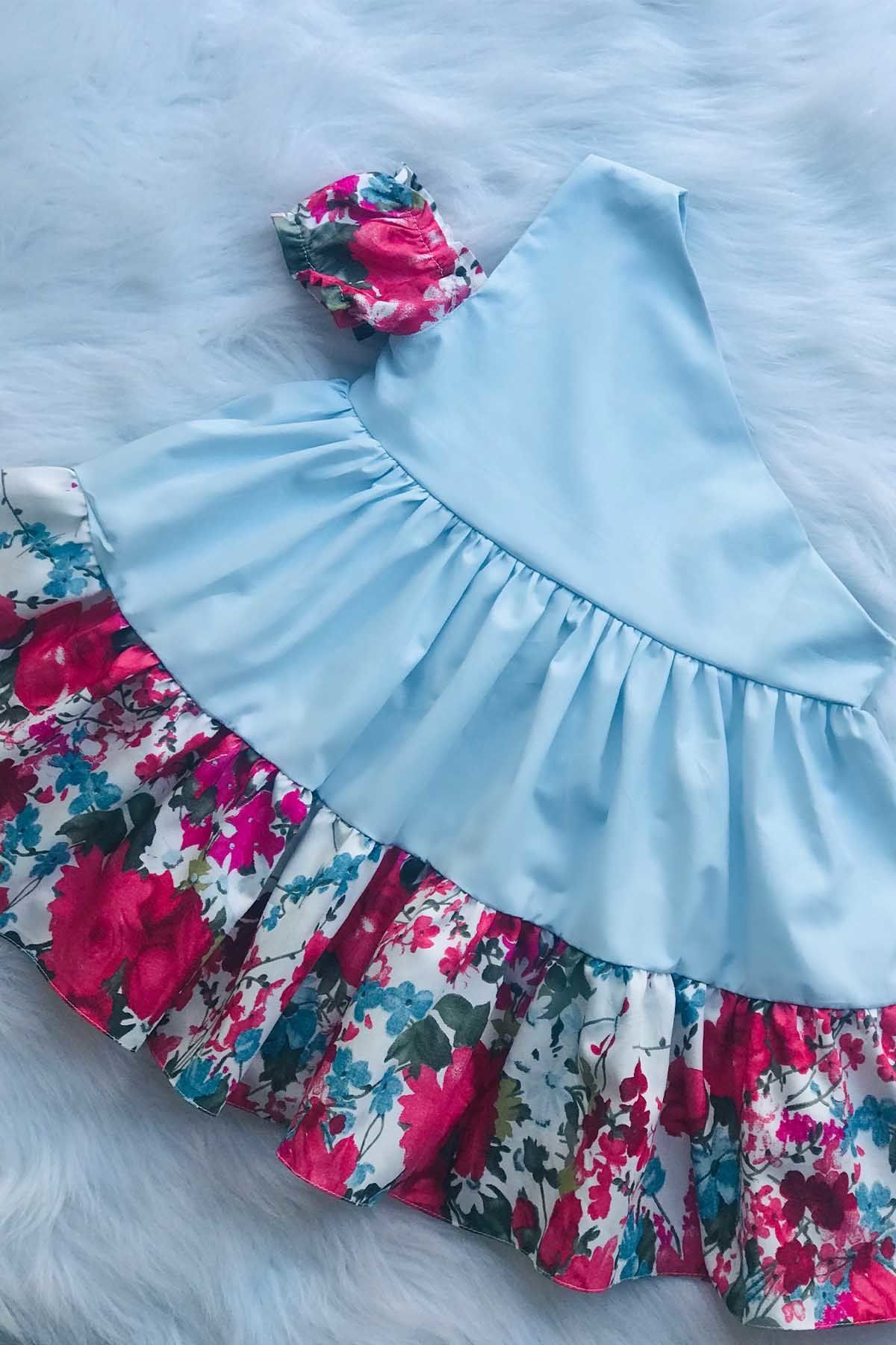 Tek Omuz Yarım Kol Bebe Mavisi Renkli Çiçekli Fiyonklu Kız Çocuk Bebek Tasarım Elbise