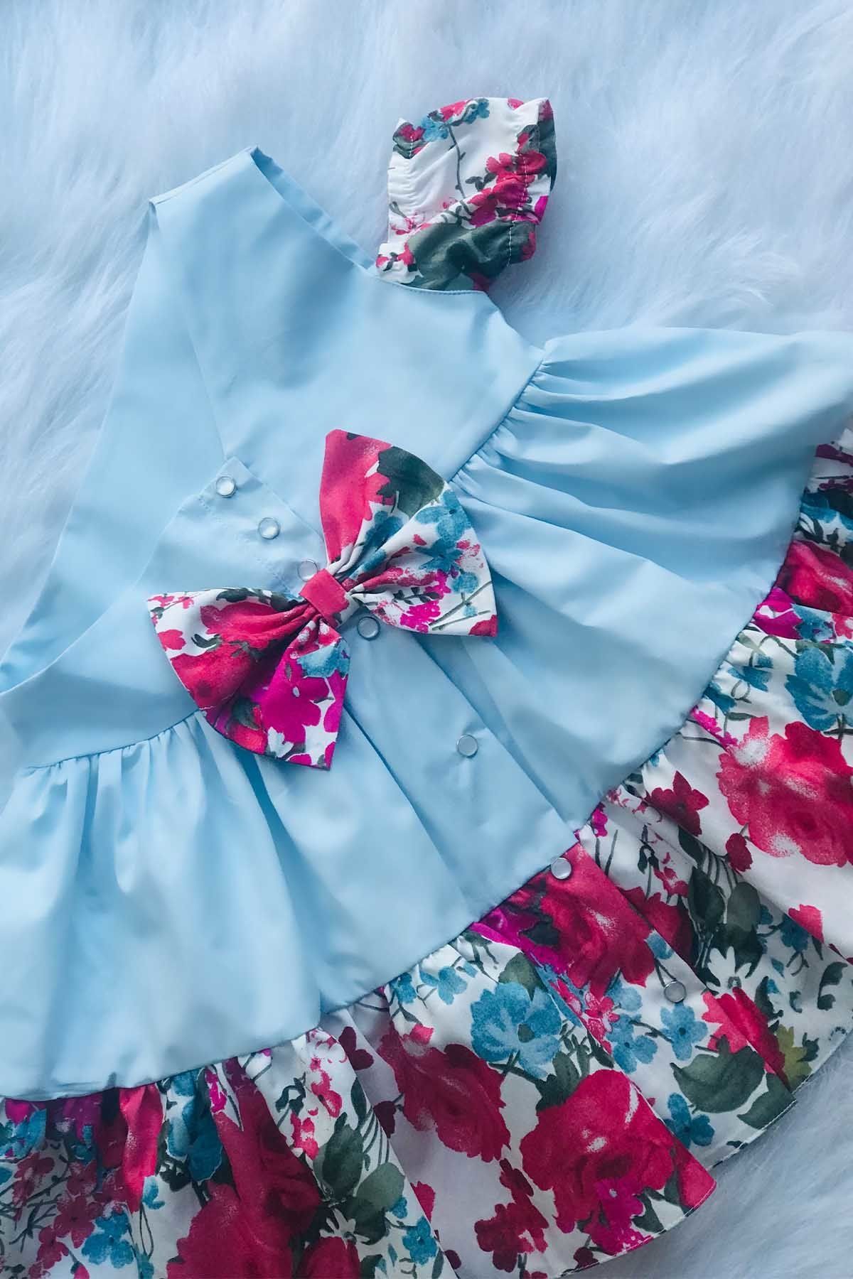 Tek Omuz Yarım Kol Bebe Mavisi Renkli Çiçekli Fiyonklu Kız Çocuk Bebek Tasarım Elbise
