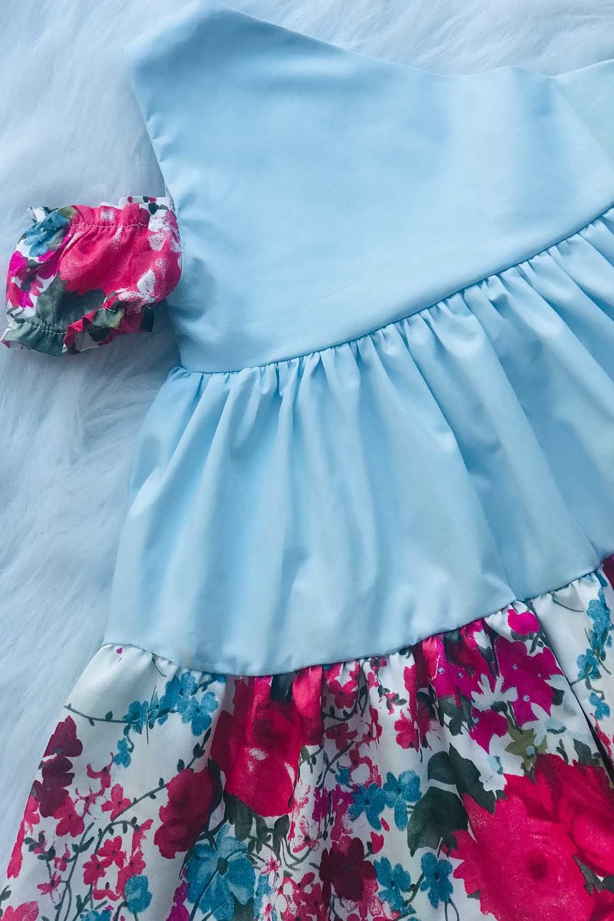 Tek Omuz Yarım Kol Bebe Mavisi Renkli Çiçekli Fiyonklu Kız Çocuk Bebek Tasarım Elbise