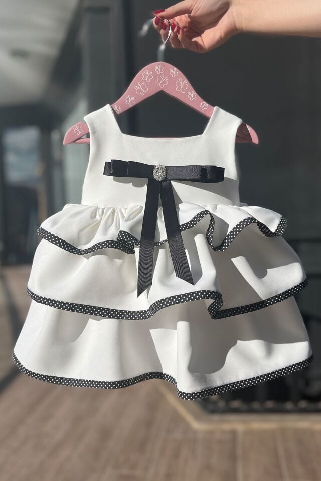 Broş ve Fiyonk Detaylı Coco Kız Çocuk Bebek Kırık Beyaz Siyah Elbise